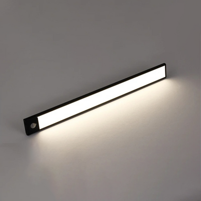 Black LED light bar illuminated on a wall